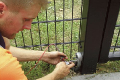 Electrician working on gate | Gate Safe